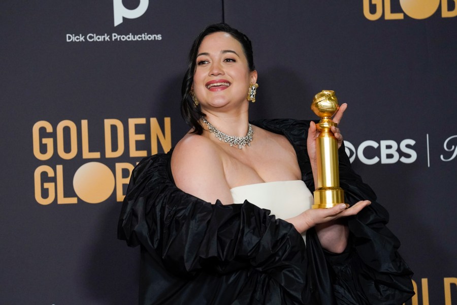 Lily Gladstone poses in the press room with the award for best performance by an actress in a motion picture, drama for