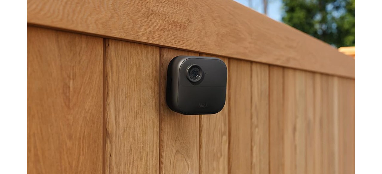 Blink Outdoor 4 (4th Gen) on wooden fence