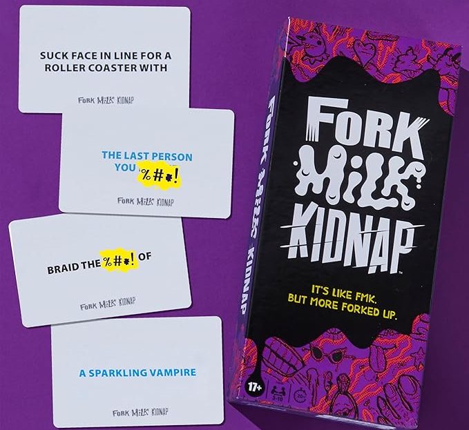 purple and black fork, milk, kidnap board game for adults box next to cards