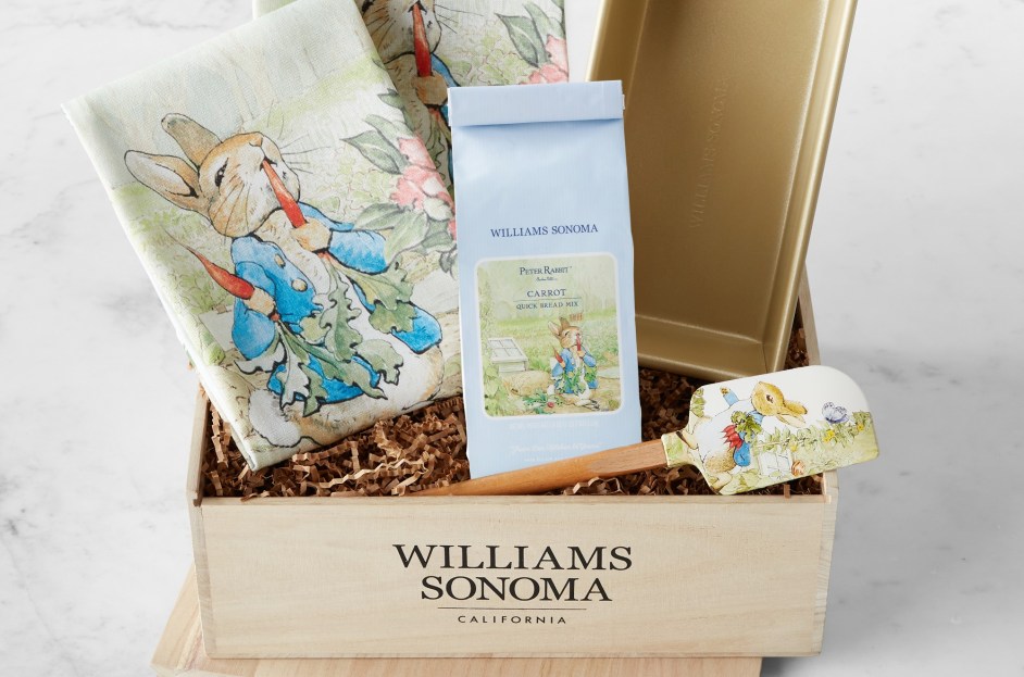crate with Peter Rabbit pattered towels, coffee and baking utensil