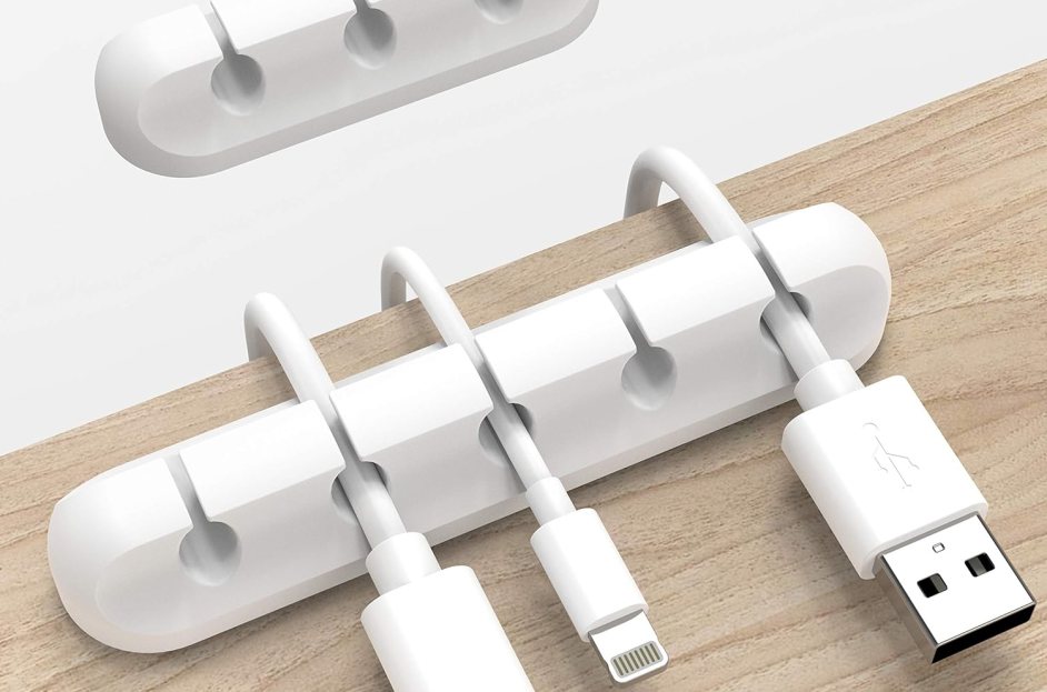 white slotted cable organizer on top of desk
