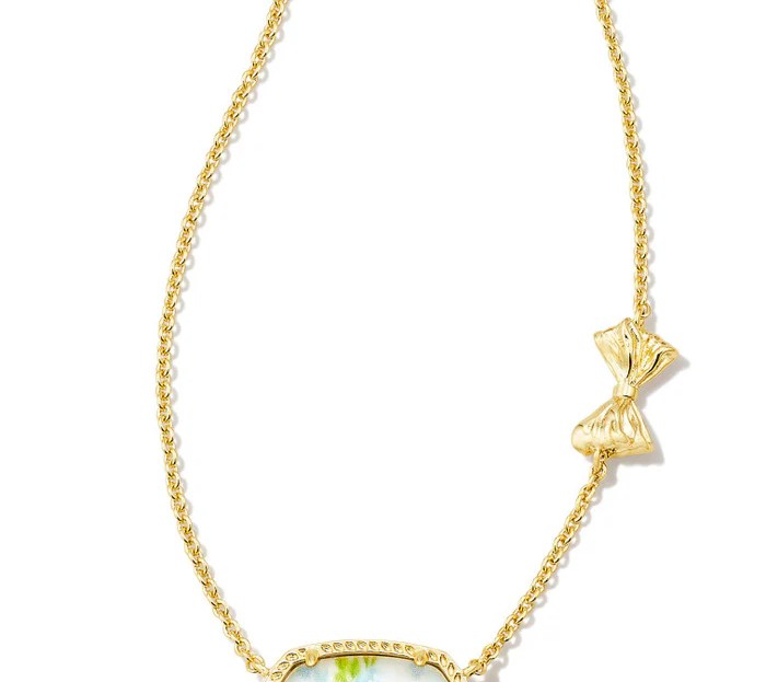 gold kendra scott necklace with blue floral