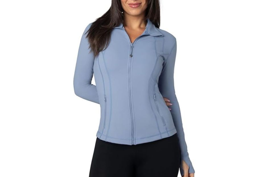 model wearing light blue athletic jacket with leggings