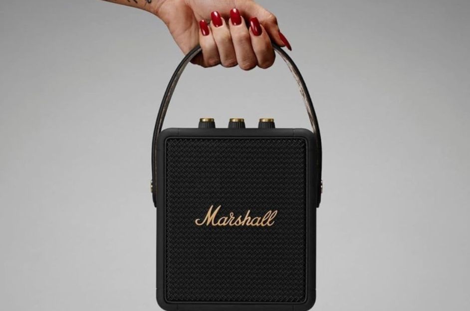 model holding black outdoor waterproof speaker