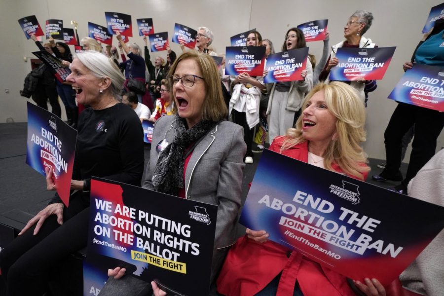 Missouri residents and pro-choice advocates react to a speaker during Missourians for Constitutionals Freedom kick-off petition drive, Feb. 6, 2024, in Kansas City, Mo. (AP Photo/Ed Zurga, File)