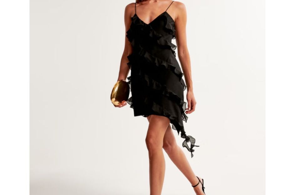 model wearing black ruffle asymmetrical dress