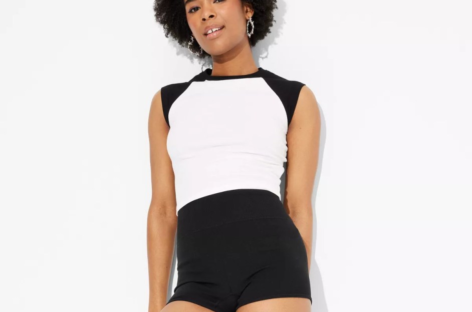model wearing micro hot shorts with white t-shirt