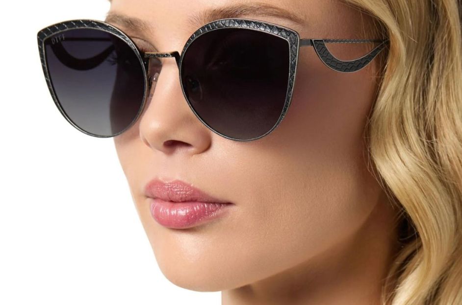 model wearing sunglasses with dragon scales