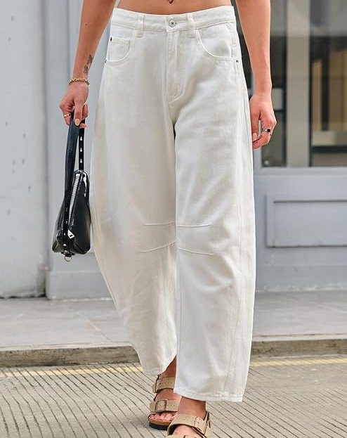 model wearing white barrel jeans with sandals