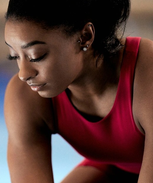 simone biles wearing red athleta crop sports bra tank