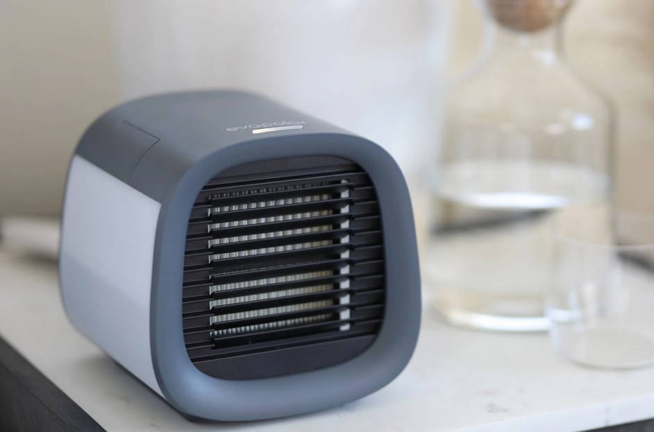 mini gray air conditioner on top of table