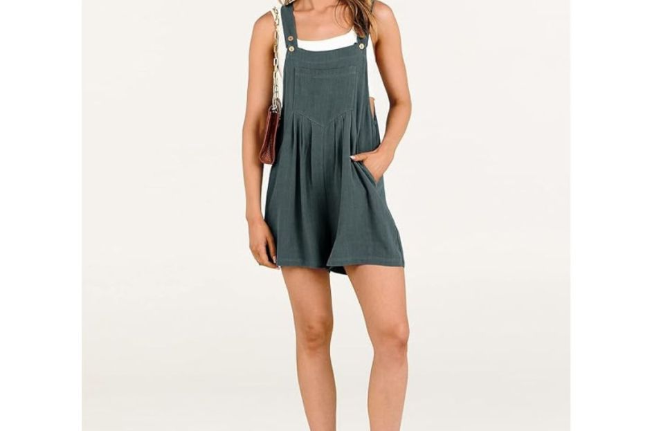 model wearing gray-blue overall romper with white tank top