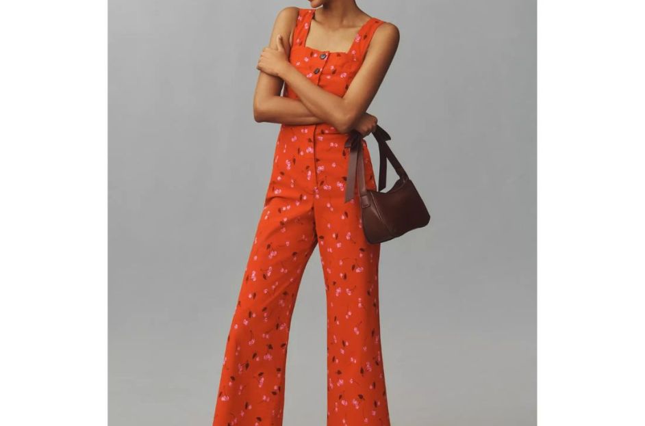 model wearing anthropologie red cherry jumpsuit