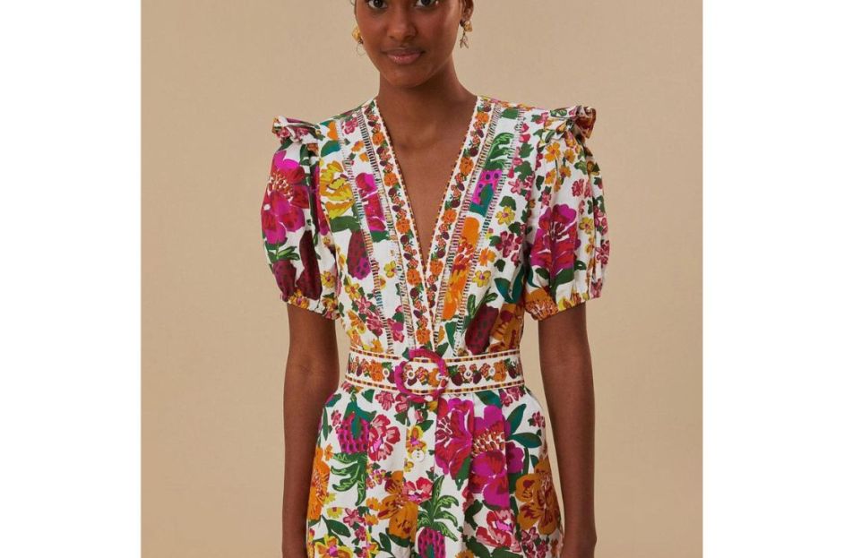 model wearing white floral farm rio romper