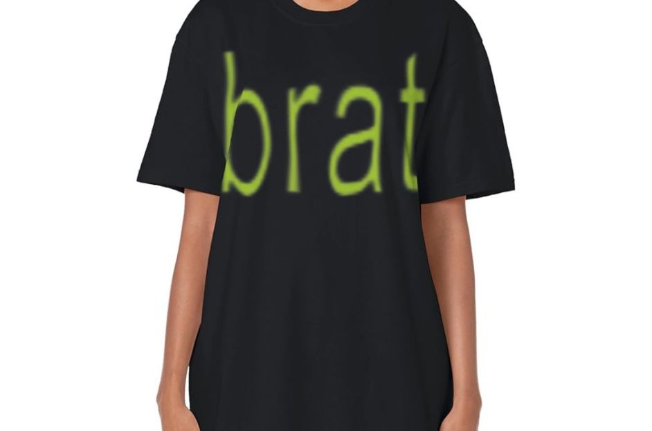 model wearing black t-shirt with green brat text and jeans