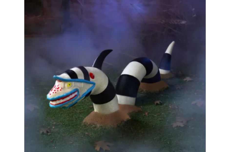 black and white sandworm from beetlejuice decoration in yard