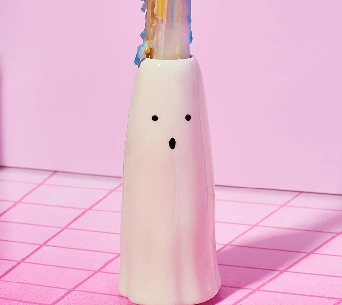 ghost candle holder with melted candle