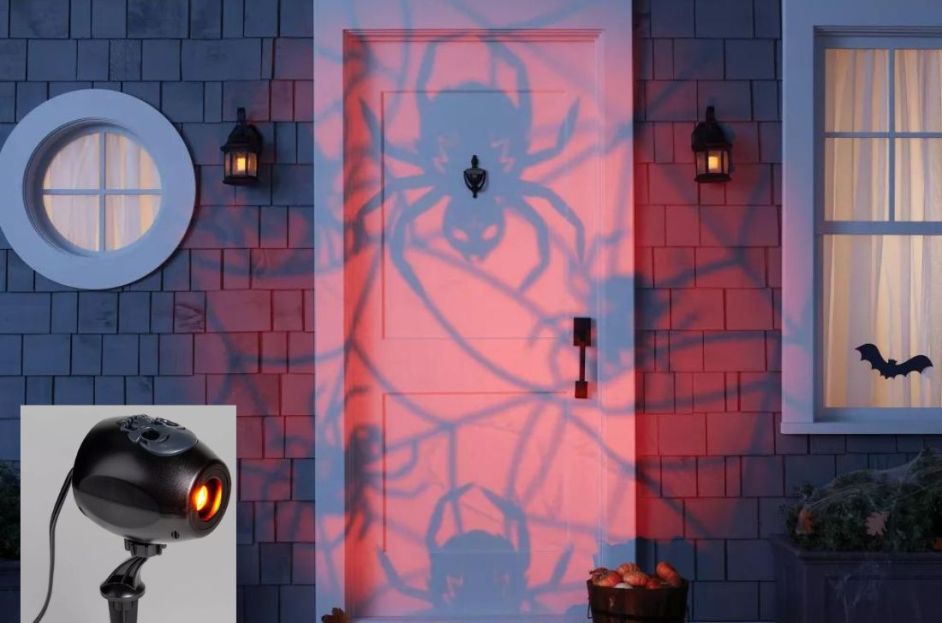 orange spider light projector on door