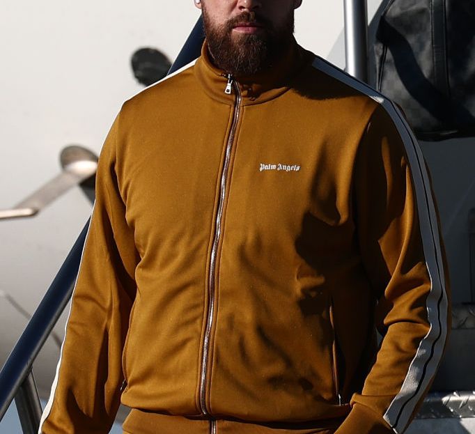 KENNER, LOUISIANA - FEBRUARY 02: Travis Kelce #87 of the Kansas City Chiefs arrives at Louis Armstrong New Orleans International Airport ahead of Super Bowl LIX on February 02, 2025 in Kenner, Louisiana.  (Photo by Chris Graythen/Getty Images)