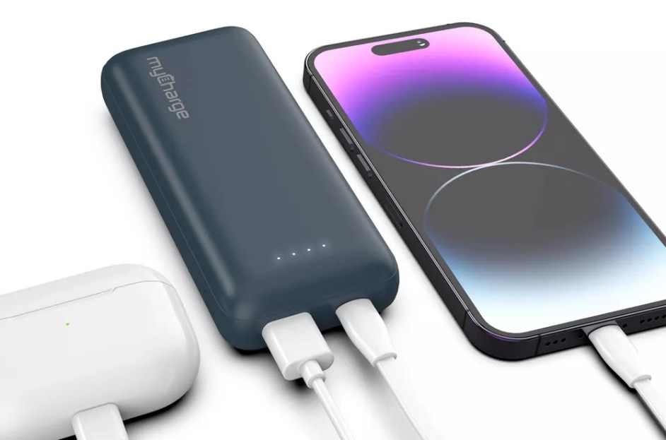 blue portable charger charger smartphone and wireless earbuds