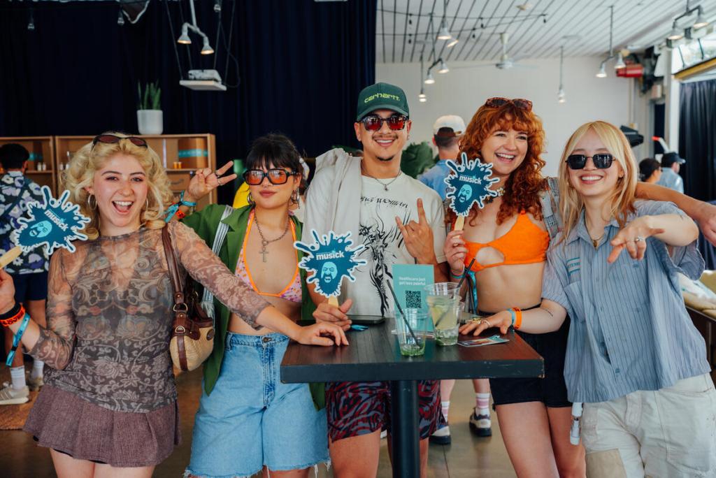 Party guests ‘fanning out’ at the Billboard and Amazon Pop-up Party held at Ace Hotel & Swim Club Palms Springs on April 12, 2025 in Palm Springs California