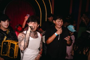 Adriel Favela (center) and Joaquín Coronel (right) sing at Los Guitarrazos at the Jardín Paraíso bar on June 11, 2025, in Mexico City.