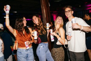 Fans raise cans of their favorite White Claw Hard Seltzer flavors