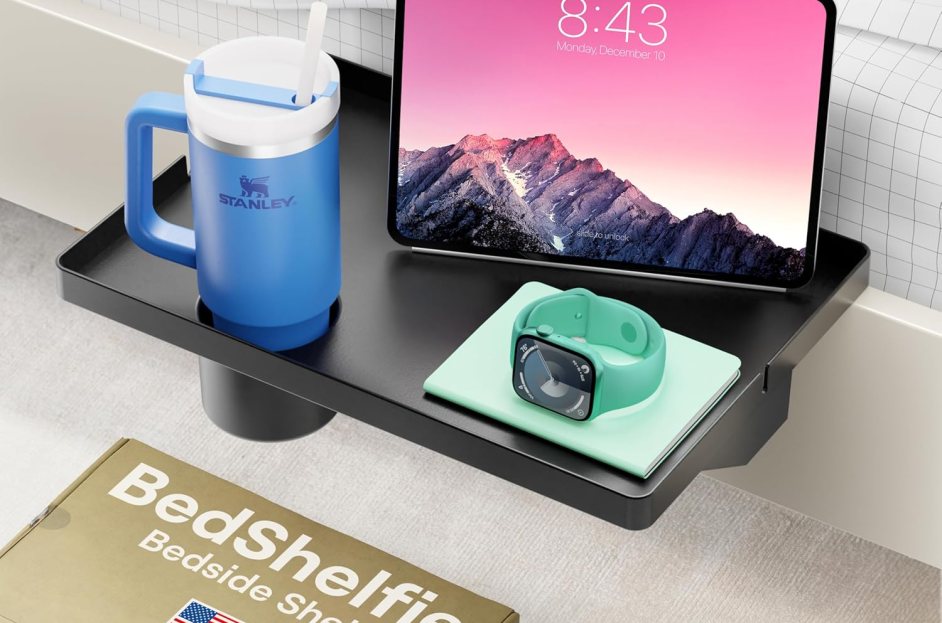 black bedside shelf with small objects on top