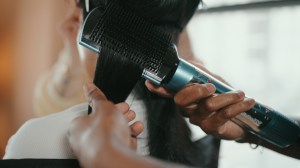 Becky's stylist blow-dried and flat ironed her hair to create a smooth look and activate the Sleek & Stay serum. 